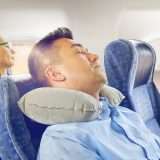 Man sleeping on a plane, how to sleep on a plane